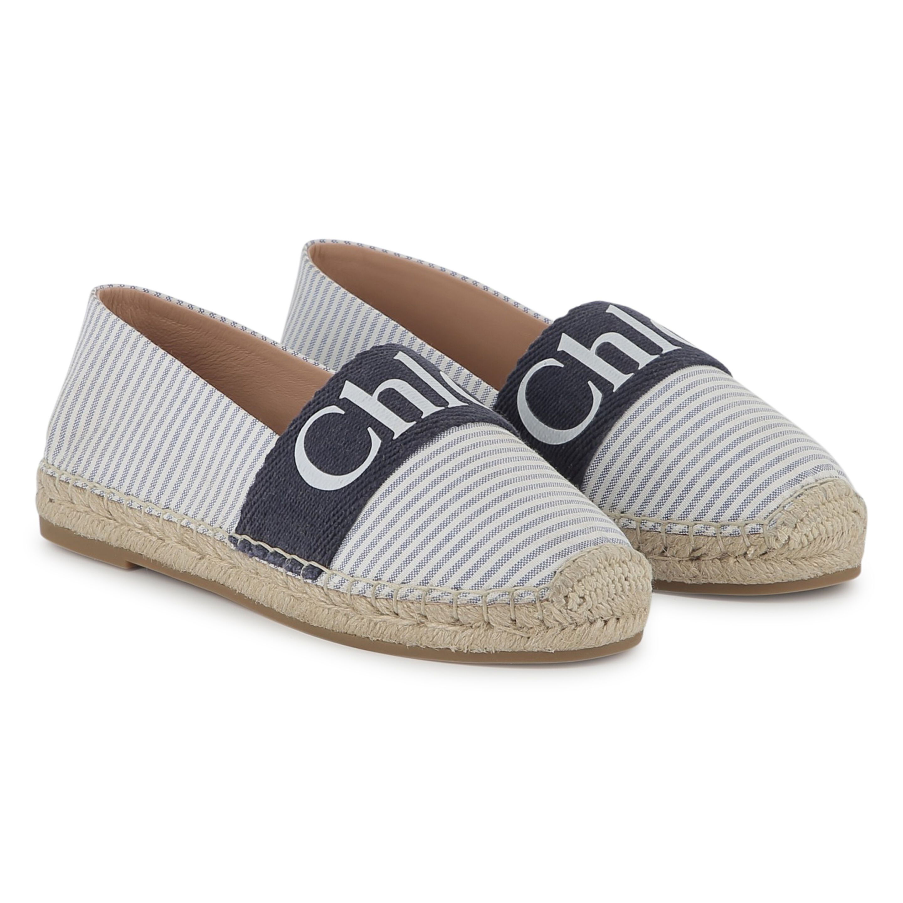Chic kids’ shoes – white sandals and blue loafers for a Mediterranean style